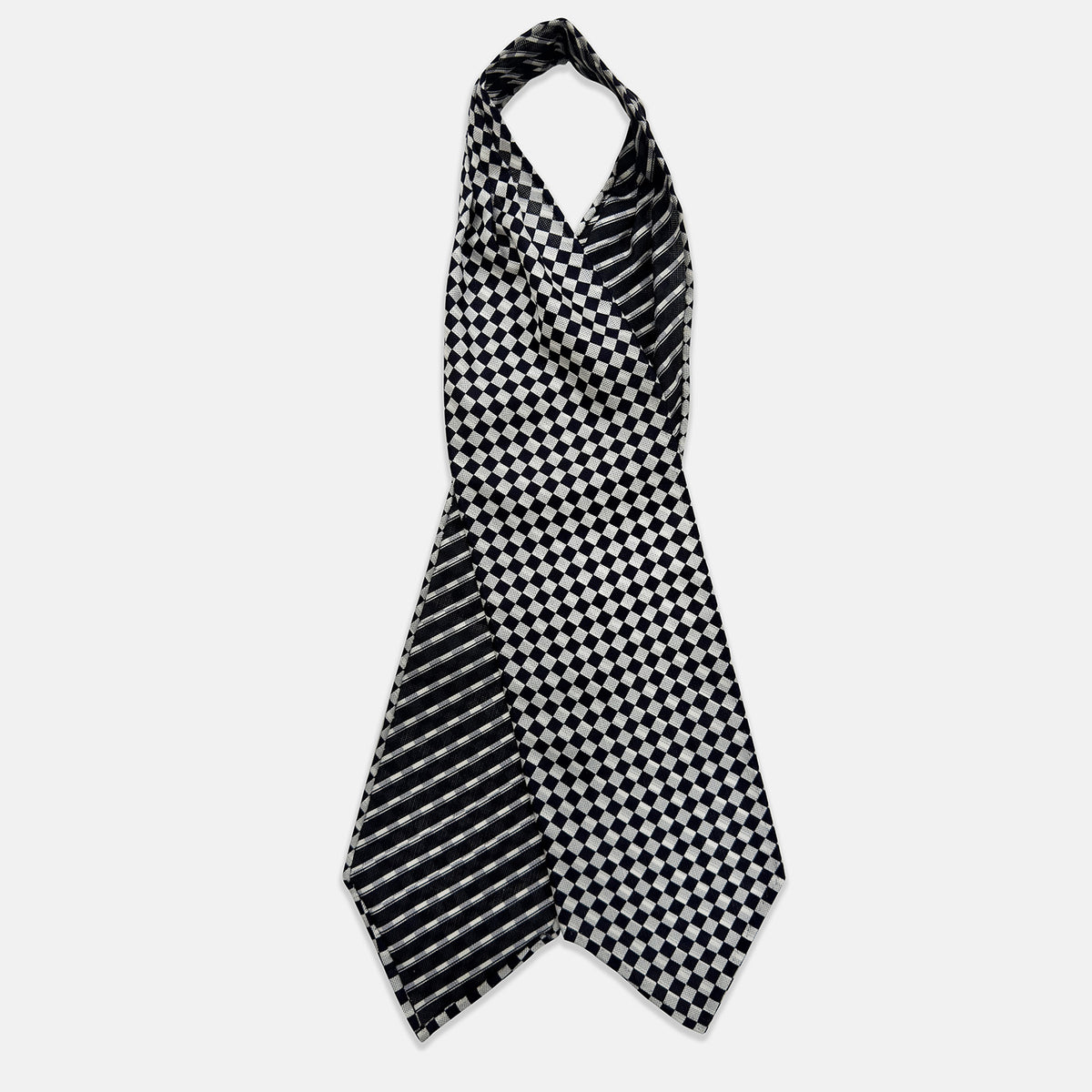 View 2 of product A folded Chequered Navy & White Silk Cravat by Turnbull & Asser UK, featuring a timeless diamond checkered pattern that channels classic British motoring elegance, displayed on a plain white background. Ideal as a double-sided silk accessory to elevate your ensemble for the Concours of Elegance 2026.