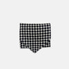View 3 of product A Chequered Navy & White Cravat in Silk by Turnbull & Asser UK, featuring a checkered pattern on one side and diagonal stripes on the other, is laid flat on a white background.