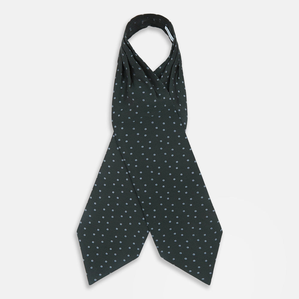 The Turnbull & Asser Pale Blue and Green Micro Dot Cravat features a refined micro dot pattern, blending pale blue and green for a sophisticated look—perfect for adding elegance to any ensemble.