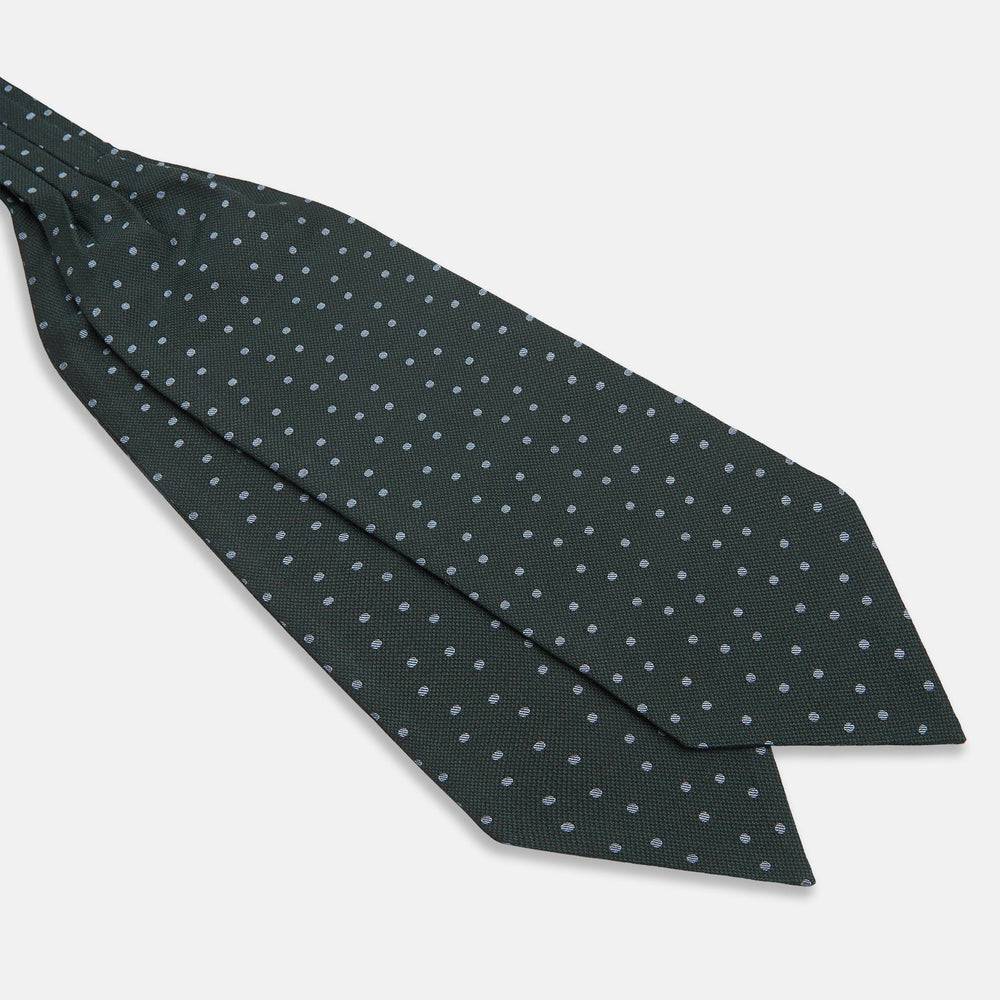 The Turnbull & Asser Pale Blue and Green Micro Dot Cravat features a refined micro dot pattern, blending pale blue and green for a sophisticated look—perfect for adding elegance to any ensemble.