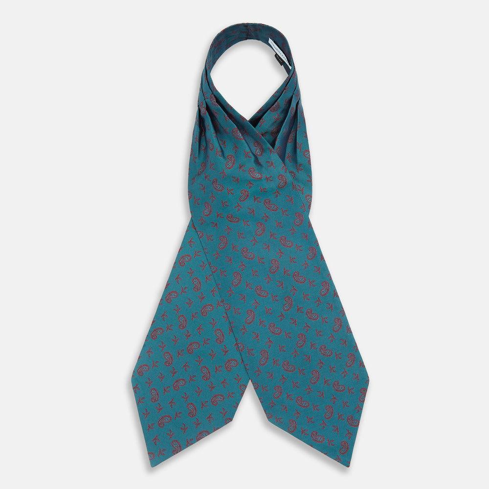 The Turnbull & Asser Teal Paisley Silk Cravat features a refined red paisley and floral pattern, adding a touch of elegance to formal men's attire.