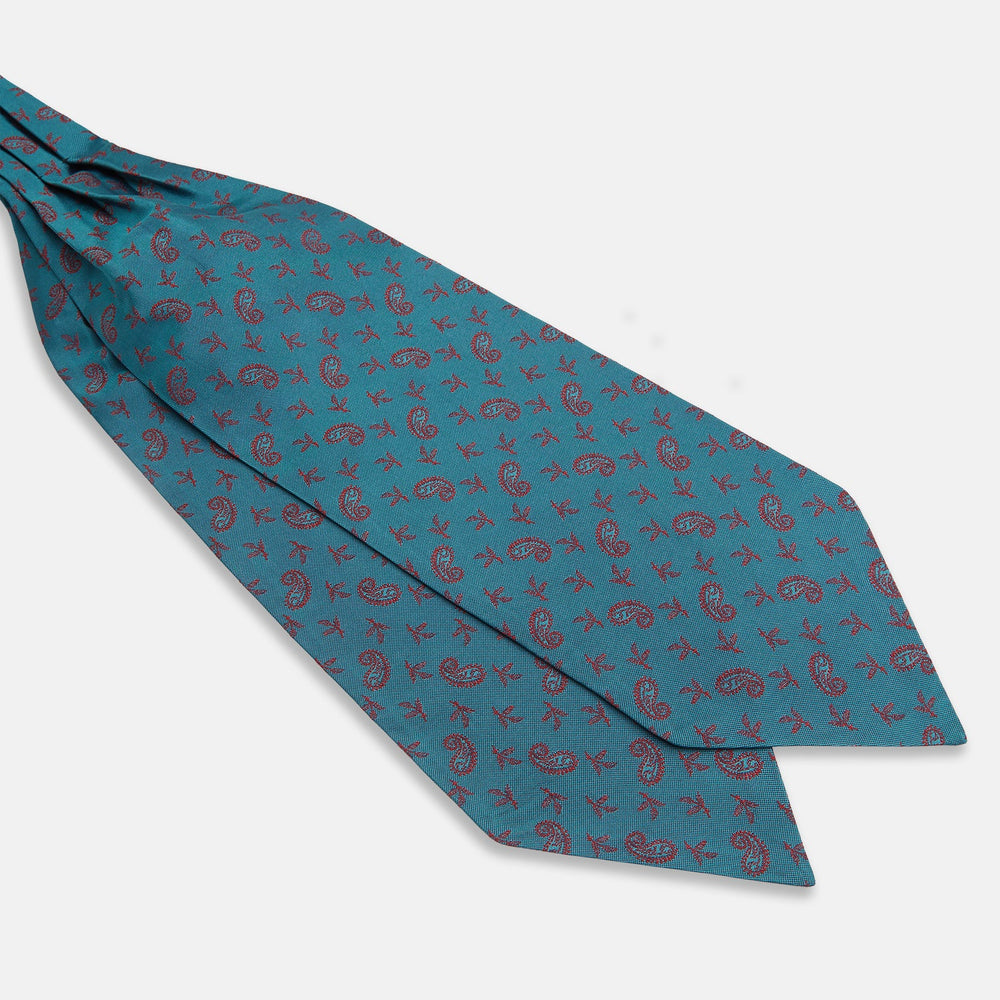 The Turnbull & Asser Teal Paisley Silk Cravat features a refined red paisley and floral pattern, adding a touch of elegance to formal men's attire.