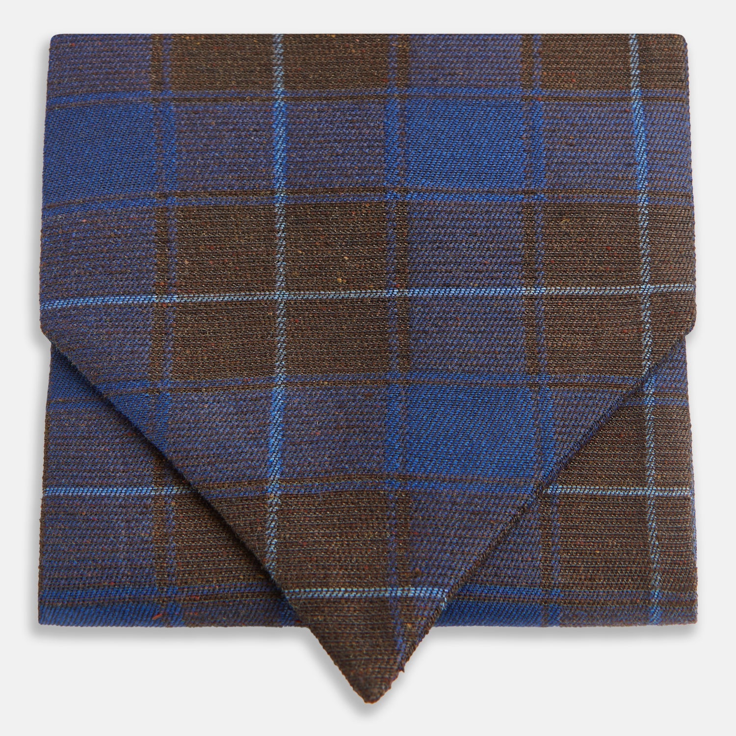View 1 of product The Turnbull & Asser Blue and Brown Tartan Silk Blend Cravat is neatly folded with sharp creases and displayed on a white background.