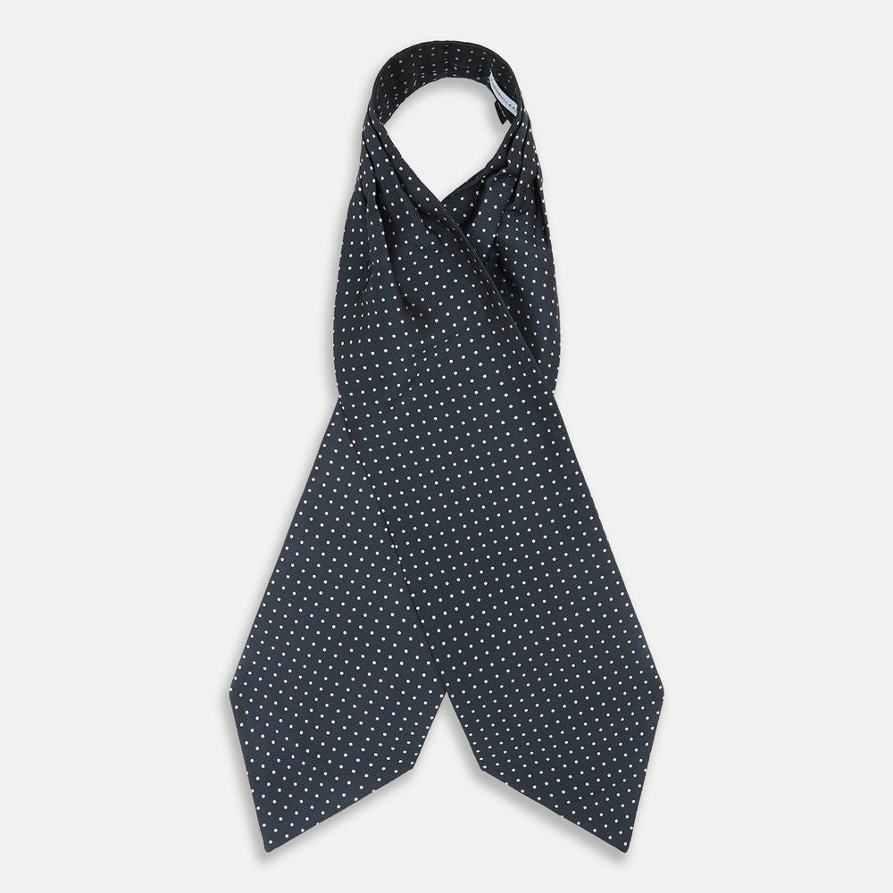 The Turnbull & Asser Navy Micro Dot Silk Cravat is a classic men's accessory, featuring subtle white polka dots—a sophisticated touch that pairs perfectly with a navy pocket square for timeless formal style.