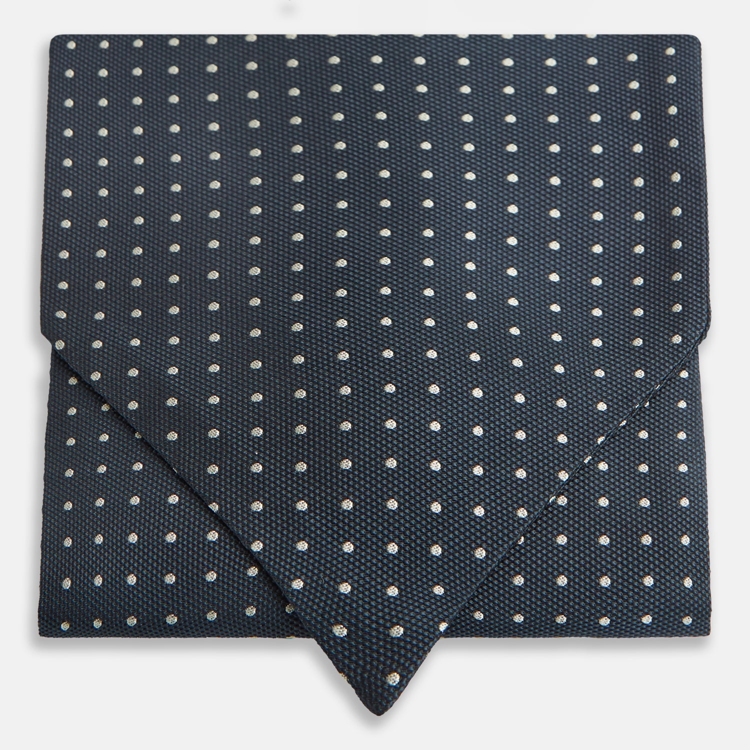 View 1 of product The Turnbull & Asser Navy Micro Dot Silk Cravat is a classic men's accessory, featuring subtle white polka dots—a sophisticated touch that pairs perfectly with a navy pocket square for timeless formal style.