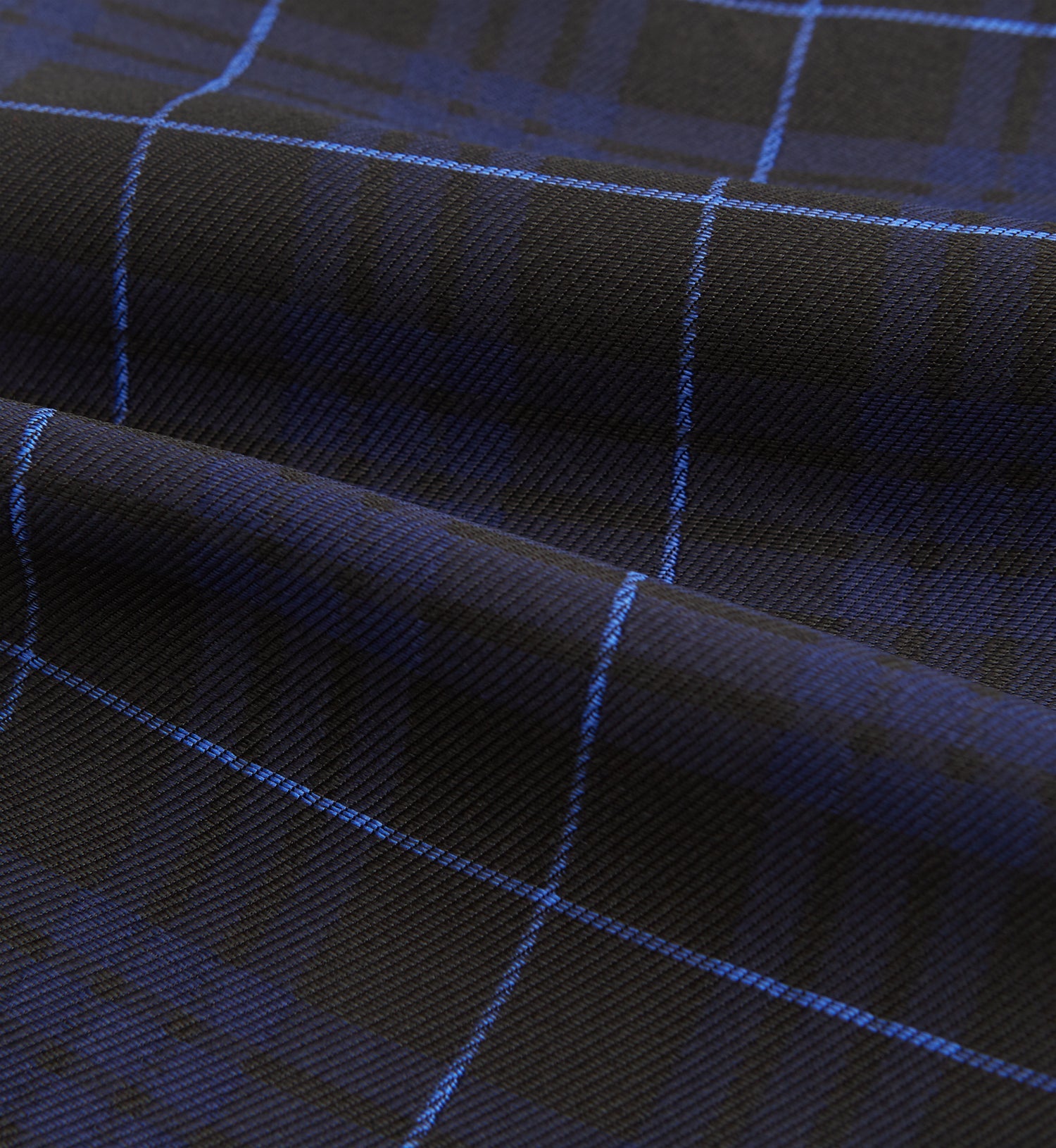 View 4 of product Pair the Turnbull & Asser Green Tartan Silk Cravat with a pocket square in a dark plaid of blue and black—a sharp, pointed accent that perfectly complements formal neckwear.