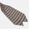 View 3 of product A folded pocket square with a houndstooth pattern in cream, brown, olive green, and burgundy with navy stripes—ideal for pairing with the Turnbull & Asser Brown Houndstooth Silk Cravat.