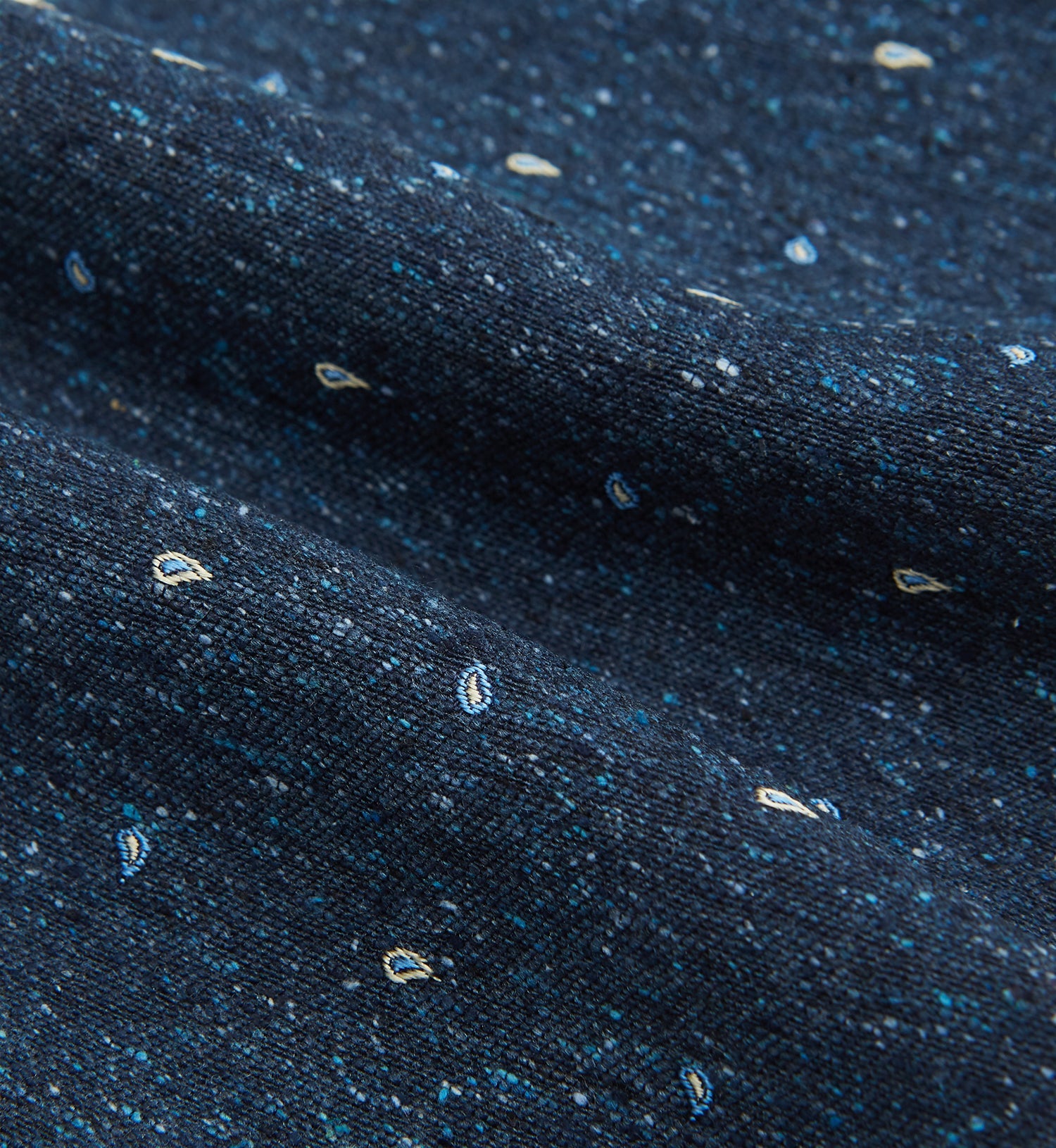 View 4 of product The Navy Micro Paisley Silk Cravat by Turnbull & Asser is a refined men's accessory, featuring subtle white paisley on silk—perfectly paired with a dark blue pocket square for an elegant formal look.