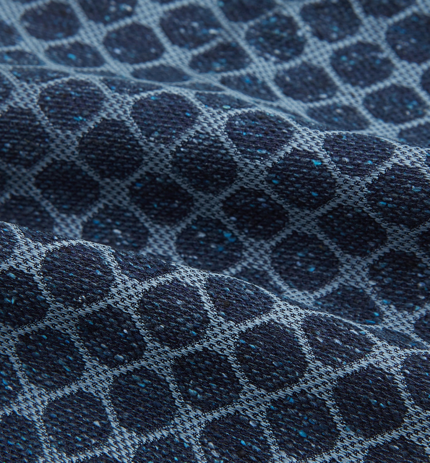 View 4 of product The Turnbull & Asser Navy Grid Silk Cravat features a textured hexagonal grid in dark and light blue on white—a refined, formal accessory perfect for any occasion.