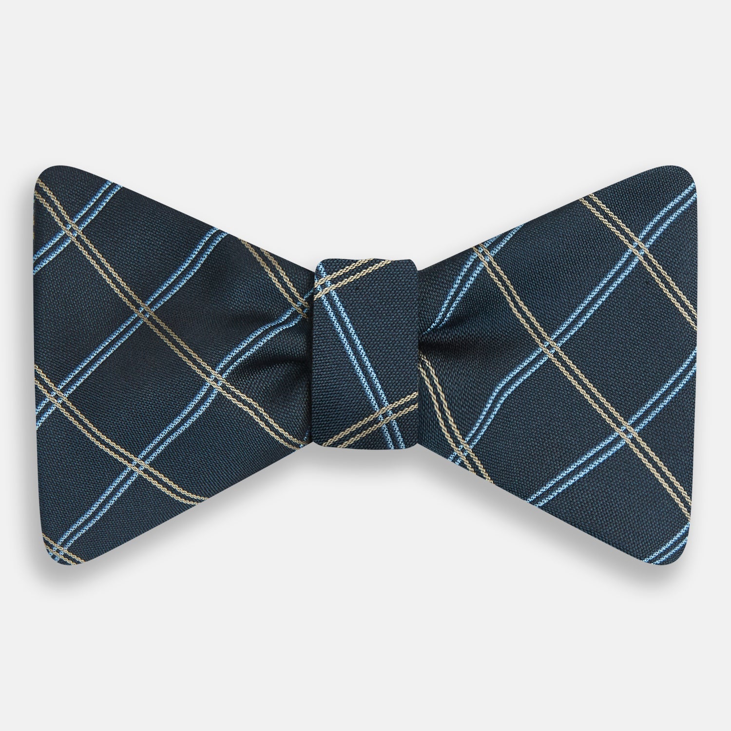 View 1 of product The Turnbull & Asser Navy Triple Check Silk Bow Tie features a navy, light blue, and beige plaid pattern on white, offering British elegance for those who value formal style.