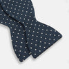 View 3 of product The Turnbull & Asser Navy Micro Dot Silk Bow Tie, shown on a white background, embodies British sophistication and classic formal style.