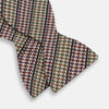 View 3 of product The Brown Puppytooth Stripe Silk Bow Tie by Turnbull & Asser features a houndstooth pattern in brown, beige, and burgundy with navy stripes—an elegant choice for formal occasions. Shown on a crisp white background.
