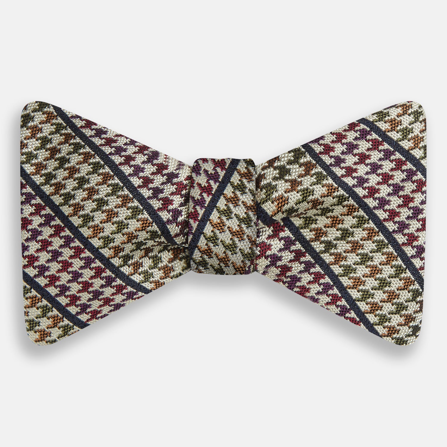 View 1 of product The Brown Puppytooth Stripe Silk Bow Tie by Turnbull & Asser features a houndstooth pattern in brown, beige, and burgundy with navy stripes—an elegant choice for formal occasions. Shown on a crisp white background.