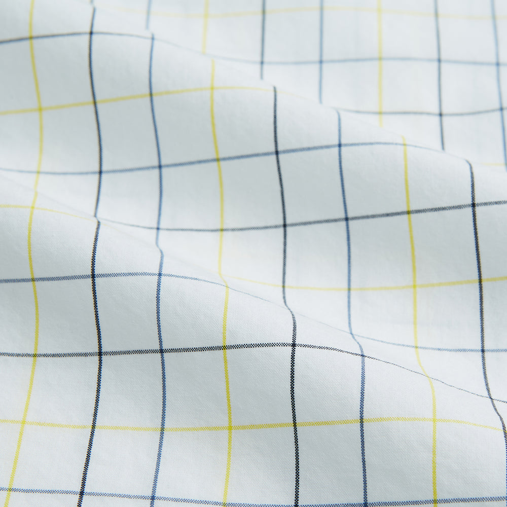 The Turnbull & Asser Yellow and Blue Grid Check Mayfair Shirt features a long-sleeve button-up design with a yellow and blue grid pattern, shown against a plain white background.