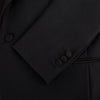 View 7 of product The Turnbull & Asser Black Single Breasted Dinner Suit, with satin lapels and matching trousers, is elegantly folded and displayed on a plain white background.