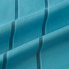 View 6 of product The Turnbull & Asser Turquoise Track Stripe Shirt features a Mayfair fit, contrast white T&A collar and double cuffs, black vertical stripes, and long sleeves, displayed flat on a light background.