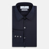 View 5 of product The Navy Westminster Shirt by Turnbull & Asser is a classic long-sleeve, button-up shirt with a pointed collar and buttoned cuffs, exemplifying British craftsmanship, shown against a plain white background.