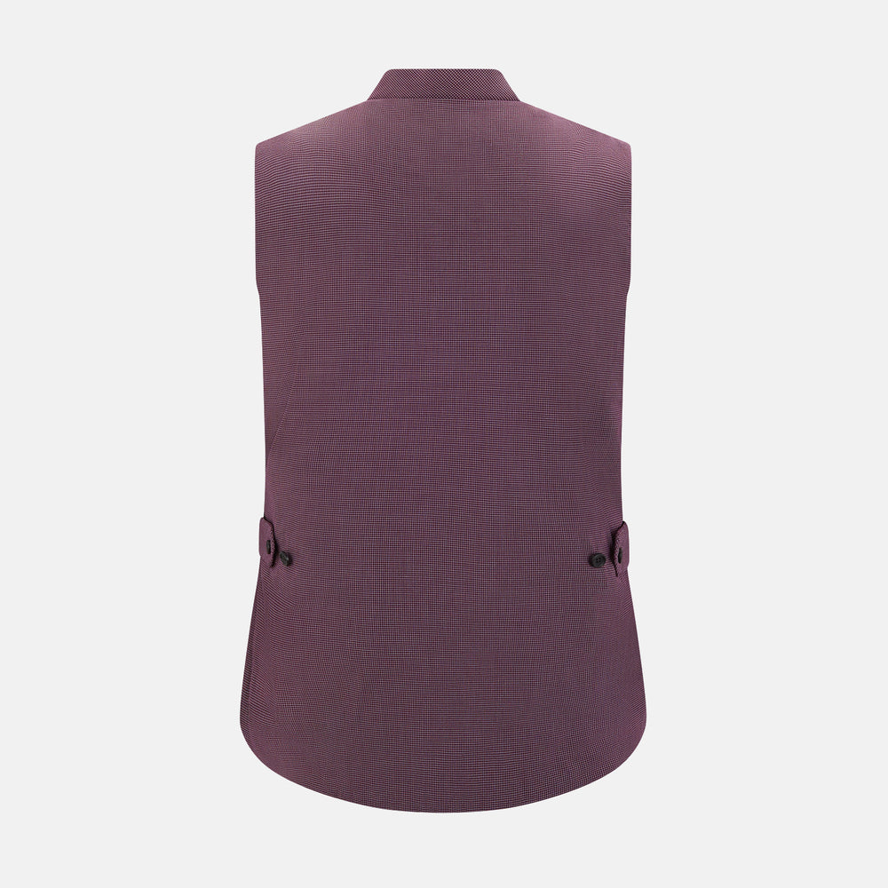 The Turnbull & Asser Burgundy Pin Check Padded Gilet features a front zipper, two zippered side pockets, a chest pocket, and a rounded hem—an ideal men’s layering piece shown on a white background.