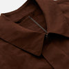 View 4 of product The Burgundy Grayson Car Coat by Turnbull & Asser, made from a rain-resistant cotton blend with a collar, hidden front buttons, and slanted pockets, is displayed flat on a white background in a minimalist style.