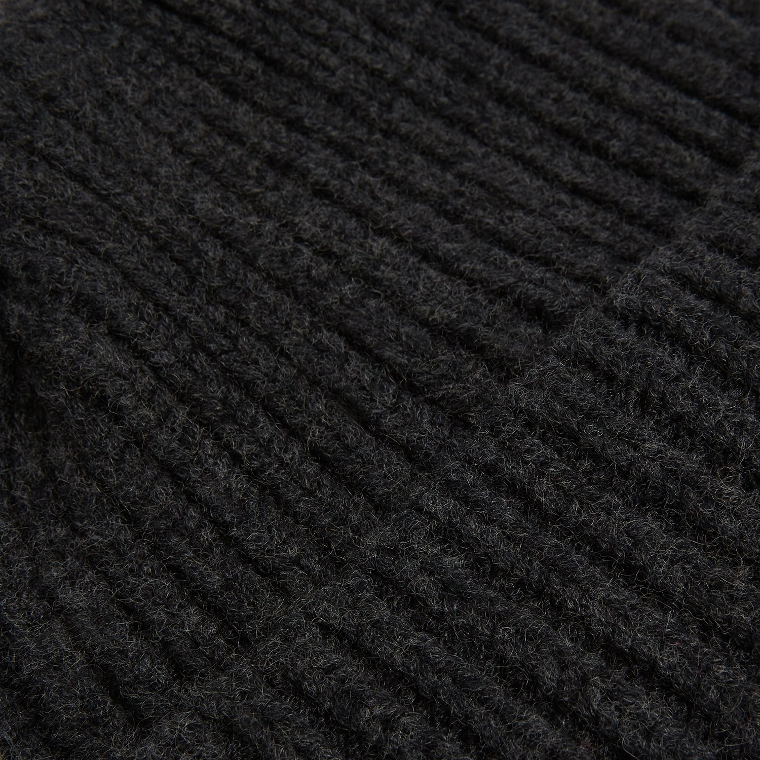 View 2 of product The Turnbull & Asser Charcoal Melange Ribbed Cashmere Beanie features a chunky knit and folded cuff, shown against a plain white background.