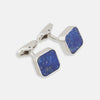 View 1 of product Turnbull & Asser Lapis Lazuli Square Cufflinks feature sterling silver settings and vibrant blue lapis lazuli inlays with gold flecks, shown on a white background.