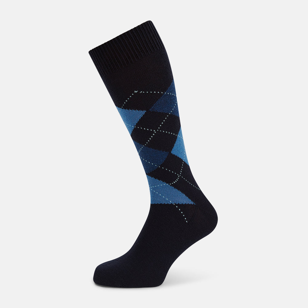 A single Turnbull & Asser Navy/Blue Wool Check Mid-Length Sock, featuring a blue and light blue check pattern, is displayed upright on a plain white background.