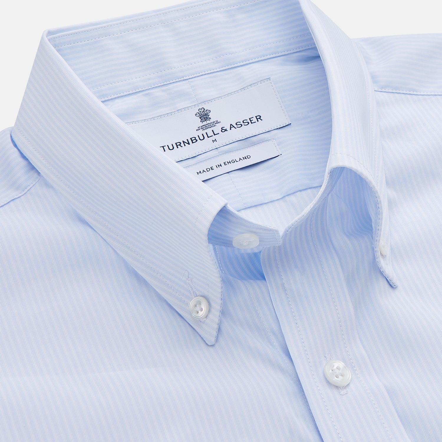 View 2 of product The Turnbull & Asser Pale Blue Stripe Cotton Weekend Fit Williams Shirt features short sleeves, a collar, a single chest pocket, and Italian cotton material, displayed on a plain white background.