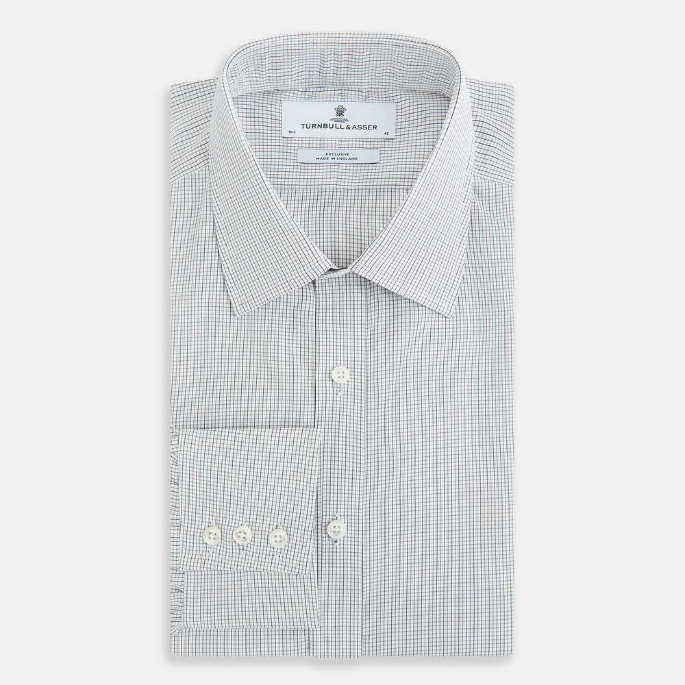 A tailored-fit Turnbull & Asser Mayfair Shirt in midnight blue with a grid check pattern, spread collar, and buttoned cuffs, crafted from premium Italian cotton and laid flat on a white background.
