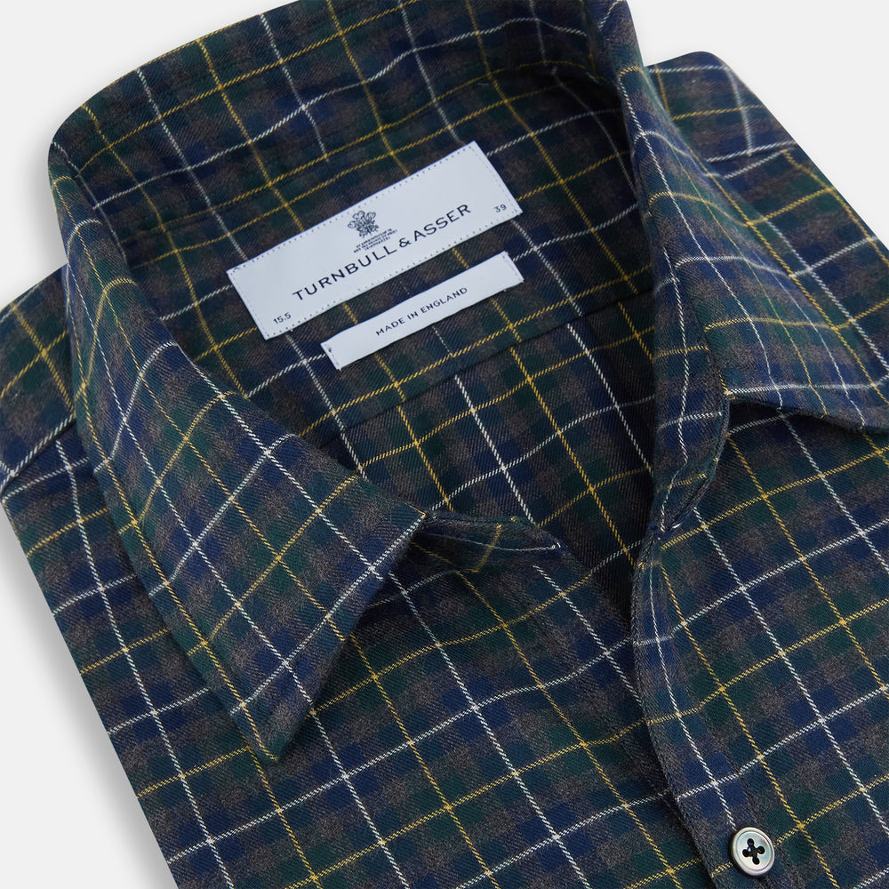 The Turnbull & Asser Navy and Khaki Tartan Windsor Shirt features a long-sleeve button-up design with a Windsor collar and buttoned cuffs, showcasing British craftsmanship in a classic tartan pattern.