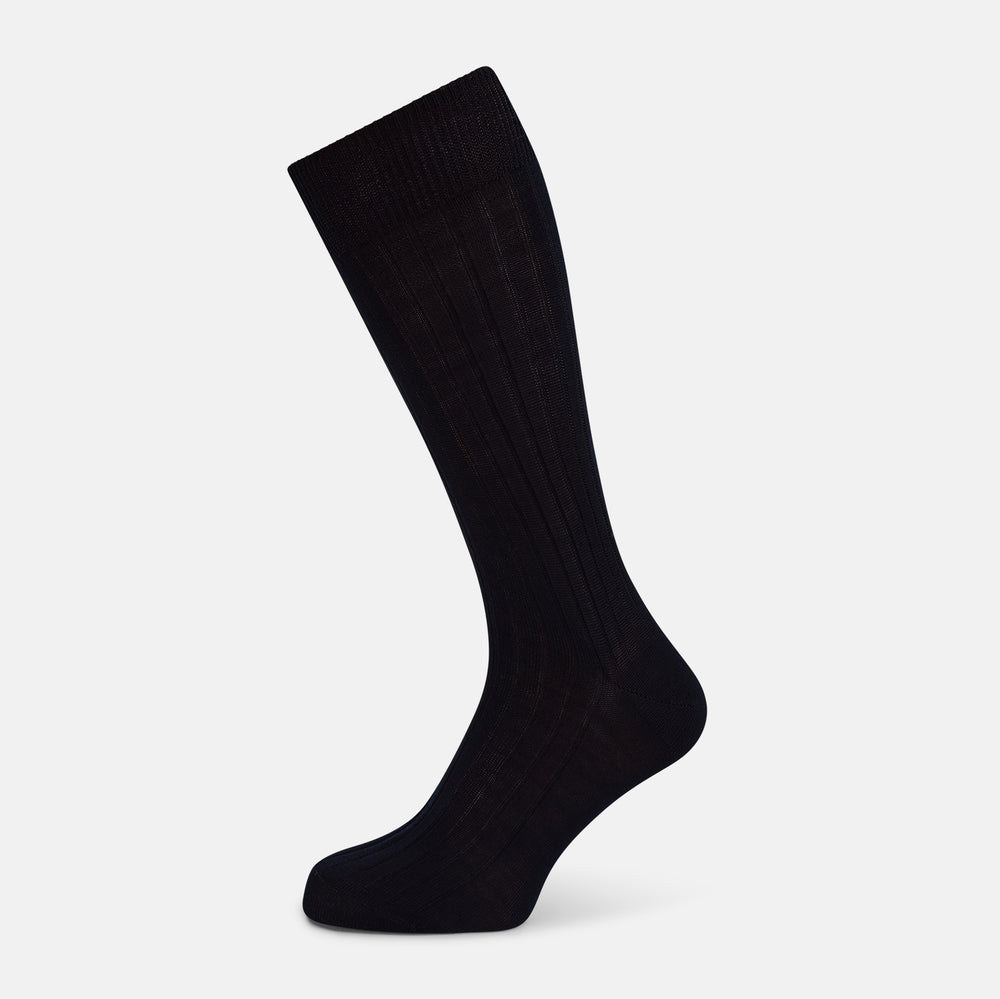 A single Midnight Thick Knit Mid-Length Sock by Turnbull & Asser, crafted from black mercerised Egyptian cotton, is shown in side profile against a plain white background with the toe pointing left.