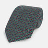 View 1 of product The Forest Green and Red Weave-Patterned Printed Silk Tie by Turnbull & Asser features an intricate geometric motif in red, green, blue, and white, crafted from luxurious English silk for classic sophistication.