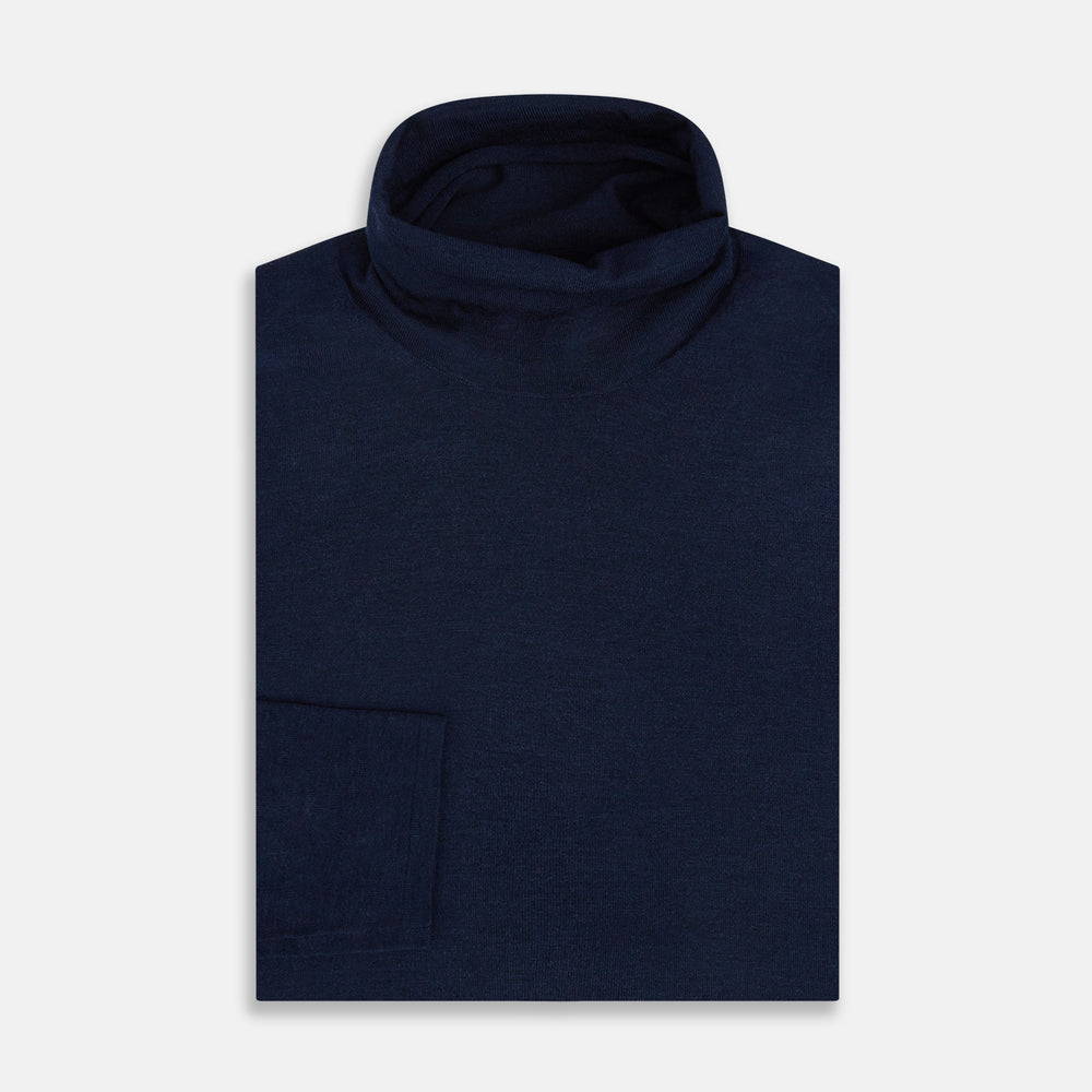 The Turnbull & Asser Navy Fine Merino High Neck Jumper, a plain long-sleeved piece crafted from premium merino wool, is shown on a white background.