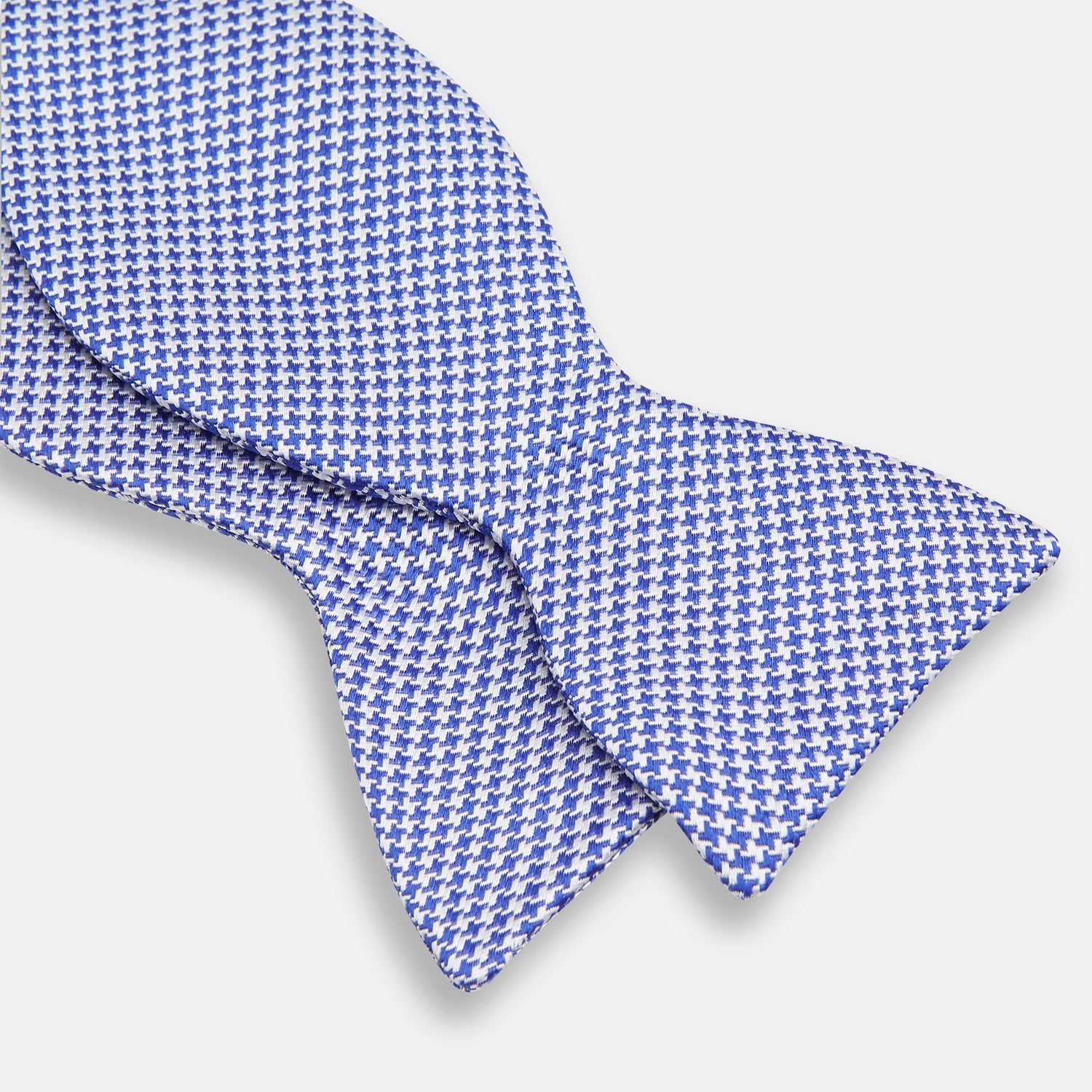 View 3 of product The Turnbull & Asser Navy and White Houndstooth Silk Bow Tie features a neatly centered knot, shown on a white background—an elegant formalwear accessory.