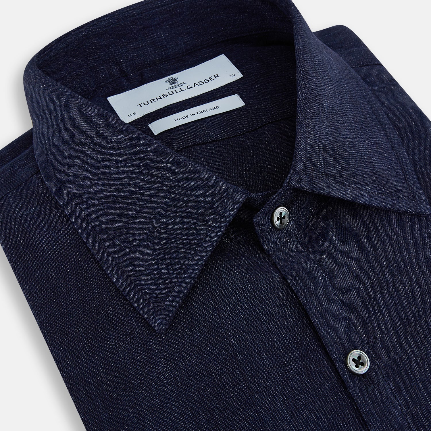 View 2 of product The Navy Linen Westminster Shirt by Turnbull & Asser features a classic collar and buttoned cuffs, exemplifying British craftsmanship. Shown here in long sleeves, the shirt is displayed flat against a white background.