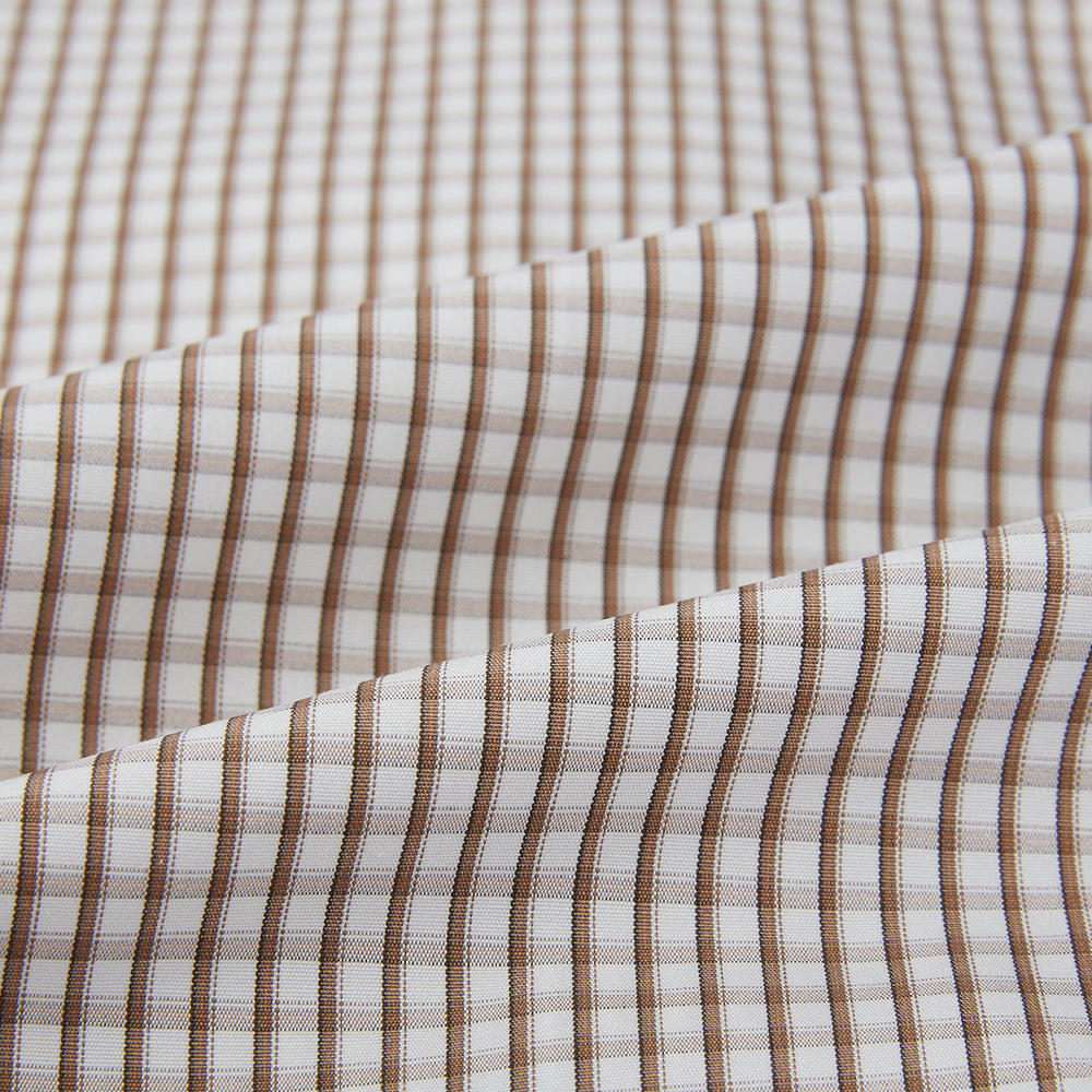 The Coffee Micro Shadow Check Mayfair Shirt by Turnbull & Asser is a long-sleeved, button-up shirt made from fine Italian cotton with a small brown and white check pattern, classic collar, and buttoned cuffs—an essential for any man’s wardrobe.