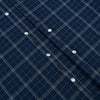 View 7 of product The Turnbull & Asser Indigo Windowpane Check Windsor Shirt features a contrast T&A collar and cuffs, highlighting British craftsmanship. It is displayed flat on a white background.