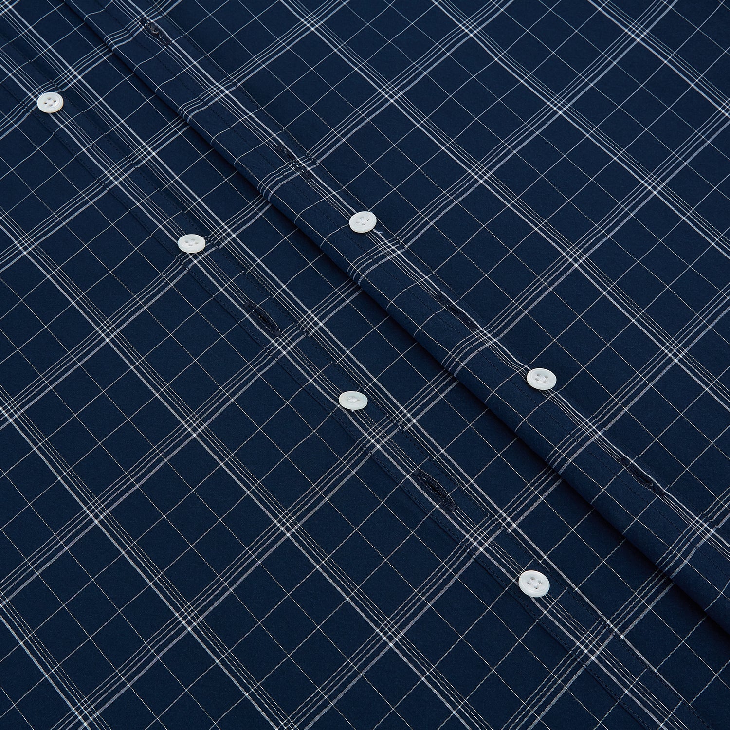 View 7 of product The Turnbull & Asser Indigo Windowpane Check Windsor Shirt features a contrast T&A collar and cuffs, highlighting British craftsmanship. It is displayed flat on a white background.