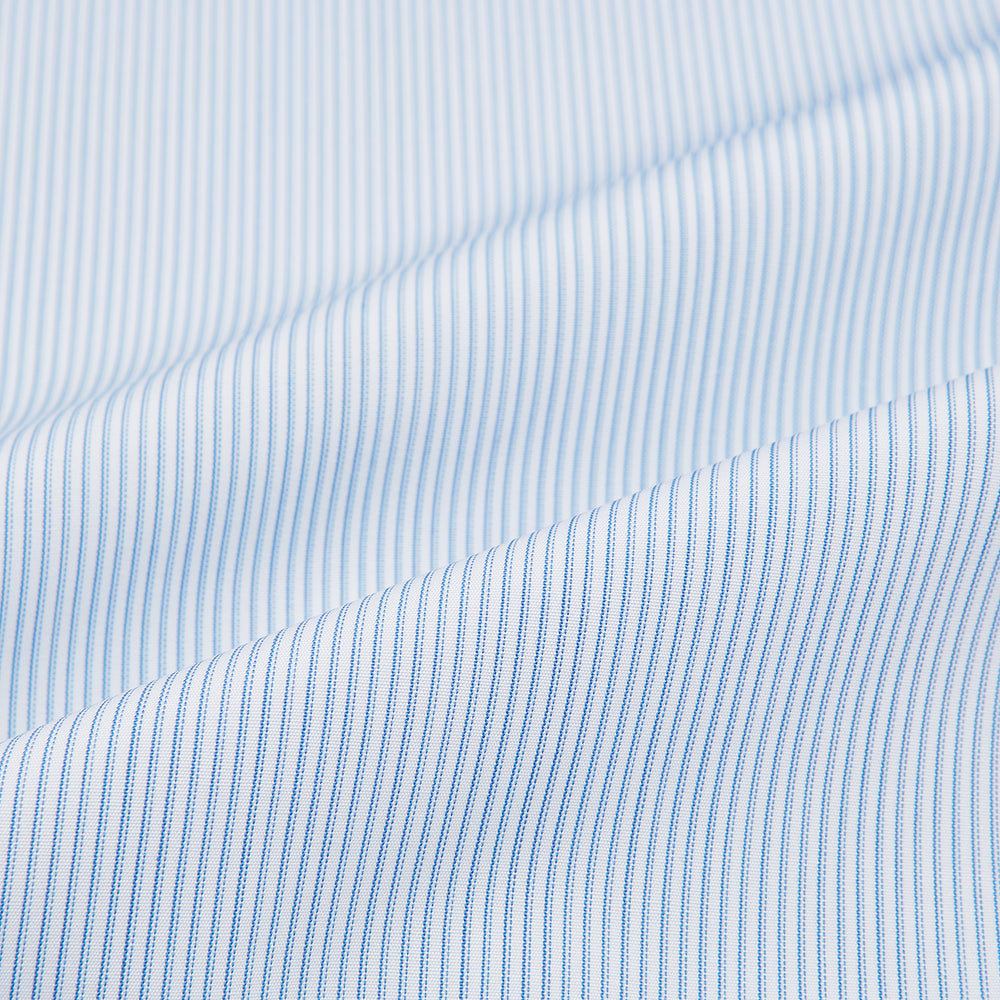 The Turnbull & Asser Sky Blue Hairline Multi Stripe Shirt features a contrast T&A collar and cuffs in white, Mayfair fit, and front buttons, displayed on a plain white background.