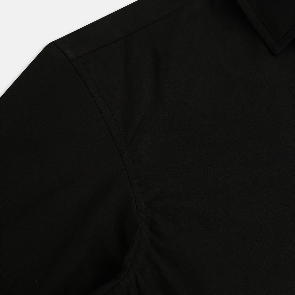 A long-sleeved, collared MIDNIGHT BLUE WINDSOR SHIRT by Turnbull & Asser, laid flat on a white background, highlights classic British craftsmanship.