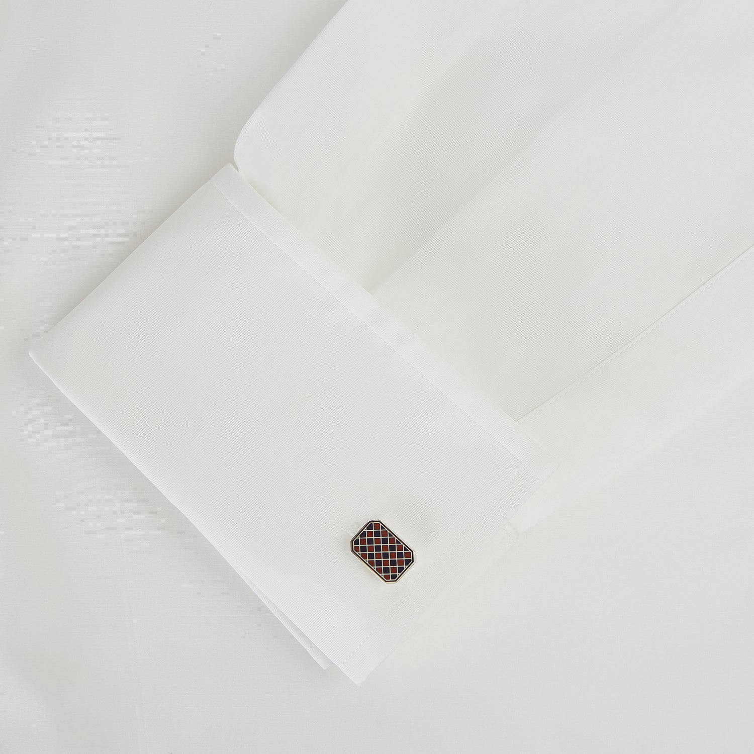 View 3 of product Turnbull & Asser Burgundy and Navy Checkered Rectangular Enamel Cufflinks boast a refined rectangular design with an enamel checkered pattern, reflecting artisanal mastery and timeless masculine elegance.