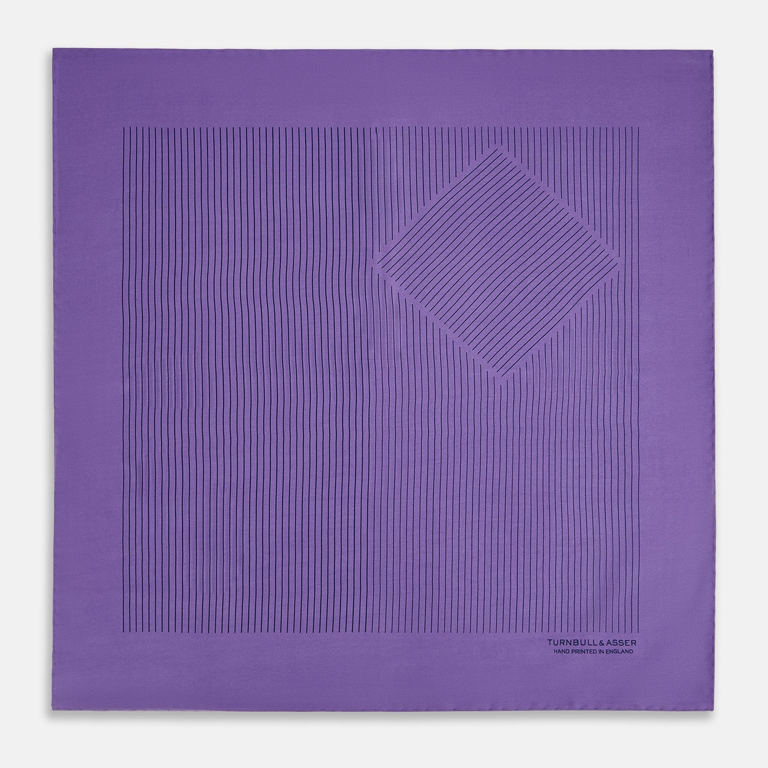View 3 of product The Purple Stripe Silk Pocket Square by Turnbull & Asser features thin black lines on purple silk—a sophisticated blazer accessory hand printed in England, showcasing classic British craftsmanship.