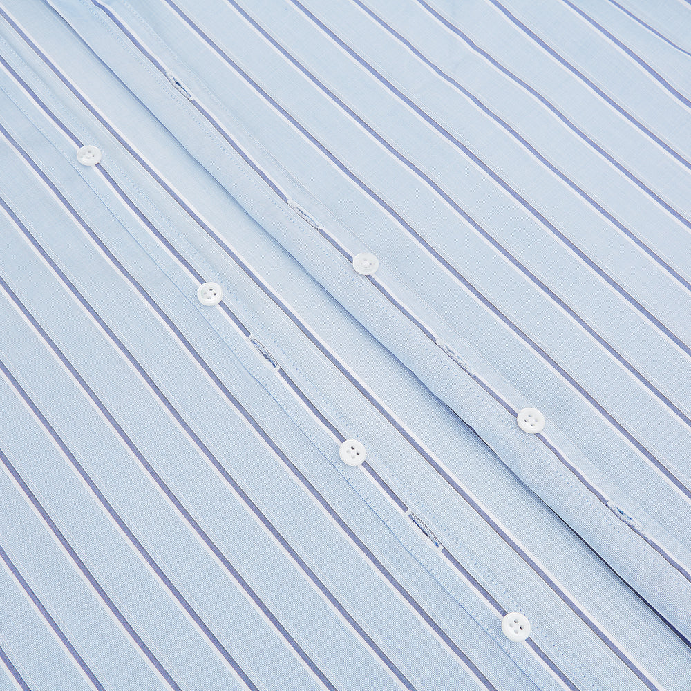 The Blue and Navy Multi-Stripe Westminster Shirt by Turnbull & Asser, featuring bold vertical stripes and a classic collar, exemplifies British craftsmanship and is shown laid flat on a white background.