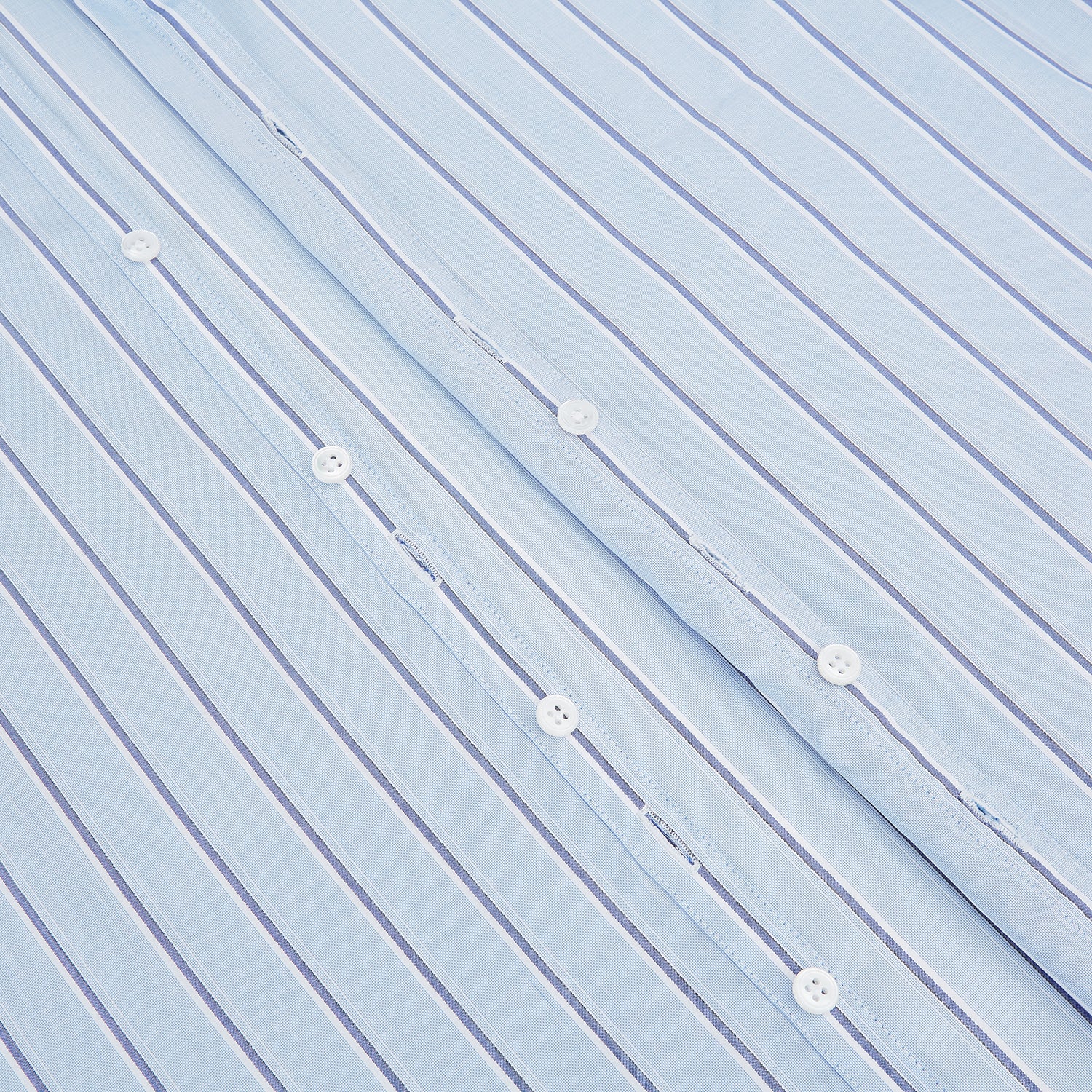 View 7 of product The Blue and Navy Multi-Stripe Westminster Shirt by Turnbull & Asser, featuring bold vertical stripes and a classic collar, exemplifies British craftsmanship and is shown laid flat on a white background.
