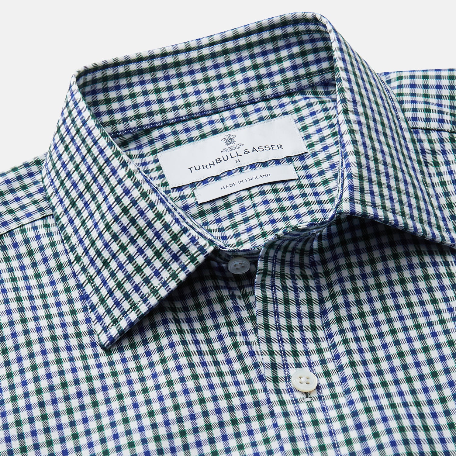 View 2 of product The Turnbull & Asser Green and Blue Cotton Multi Check Weekend Fit Finch Shirt features long sleeves, a pointed collar, and buttoned cuffs—perfect for versatile style. Laid flat on a white background.