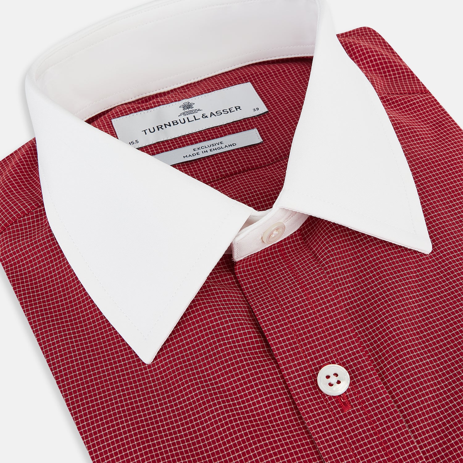 Image 2 of product The Turnbull & Asser Dark Red Pin Check Shirt features a crisp white contrast collar and cuffs, with long sleeves and button-up design, shown against a white background.