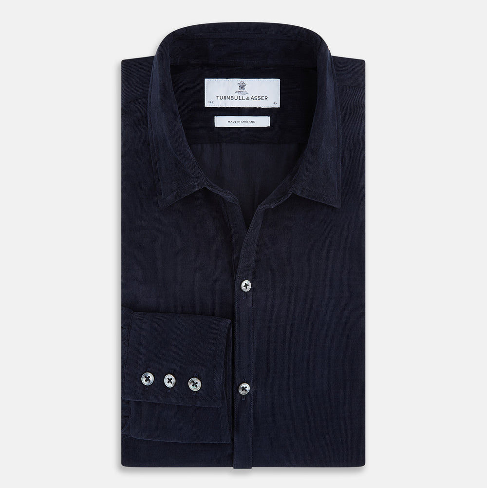 A navy corduroy Windsor shirt by Turnbull & Asser, featuring British craftsmanship and a classic collar, displayed on a plain white background.