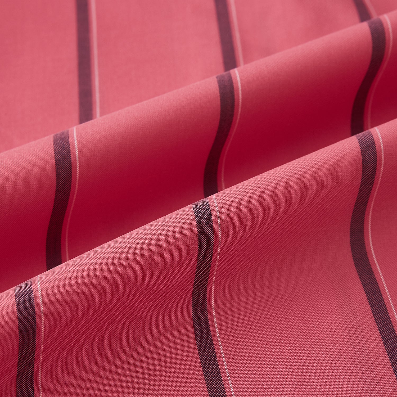 View 6 of product The Coral Red Track Stripe Mayfair Shirt by Turnbull & Asser features long sleeves, button-up front, a classic T&A collar, and buttoned cuffs in vibrant Italian cotton with vertical black pinstripes, shown on a plain white background.
