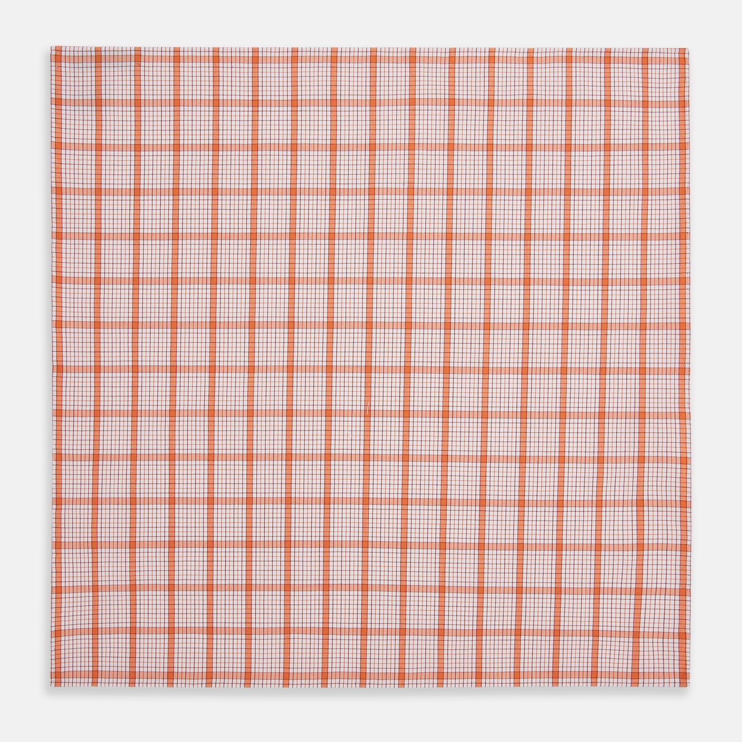 View 6 of product The Turnbull & Asser Hand Rolled Orange Graph Overlay Check Handkerchief features bold orange and white checks with blue and orange grid lines—a refined, classic accessory for any gentleman.