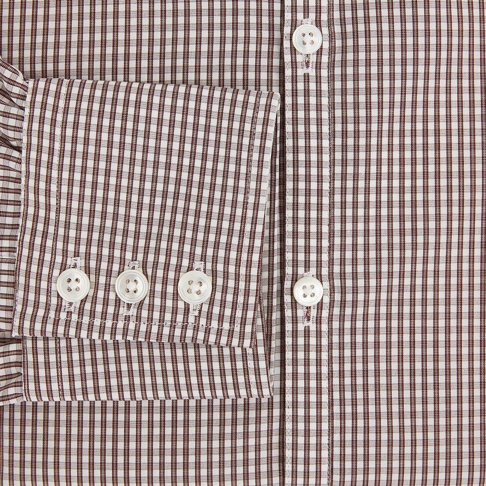 The Turnbull & Asser Burgundy Micro Check Westminster Shirt is a long-sleeved button-up with a classic collar and tailored fit, featuring a subtle micro check pattern, shown against a white background.