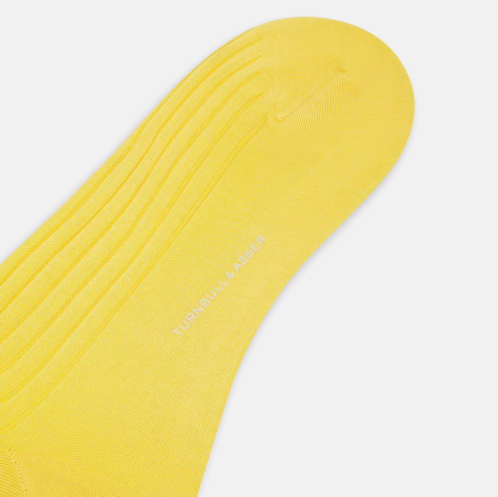 A single Chartreuse Lemon Long Sock by Turnbull & Asser, knee-high with a ribbed texture and made from luxurious Egyptian cotton, is displayed against a plain white background.